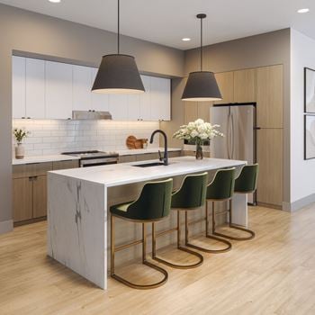 Modern kitchen with white marble island and green bar stools